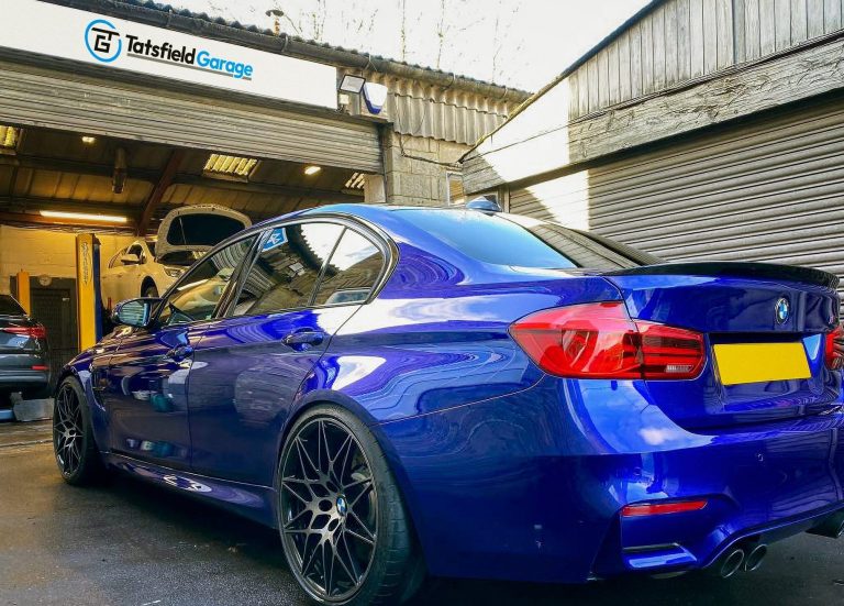 A blue BMW outside Tatsfield Garage